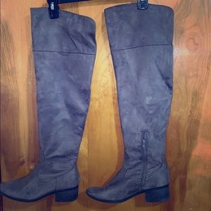 Over the knee tan boots.